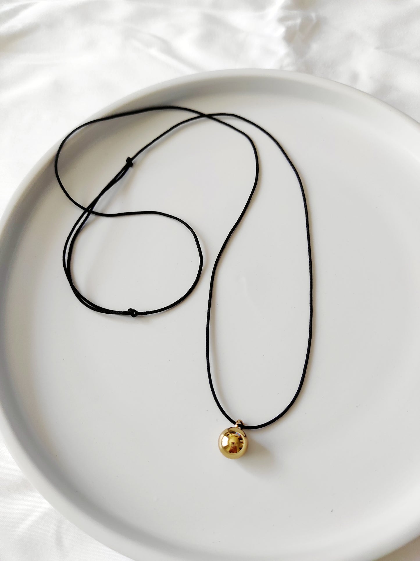 Golden pearl necklace